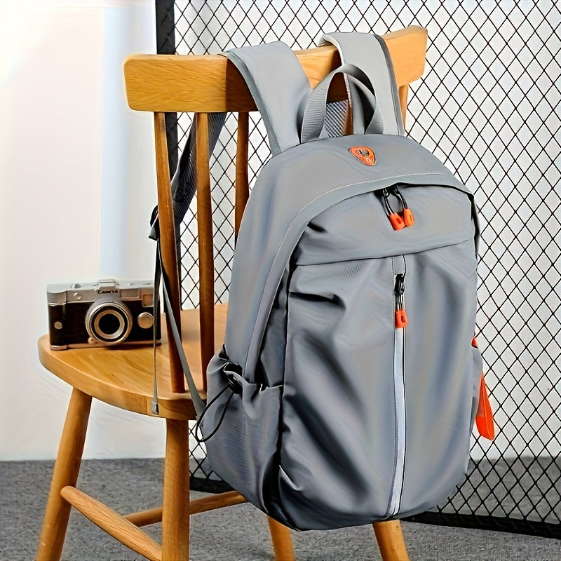 Men's light gray backpack made of stylish polyester with zippered compartments, adjustable straps for school and outdoor travel.