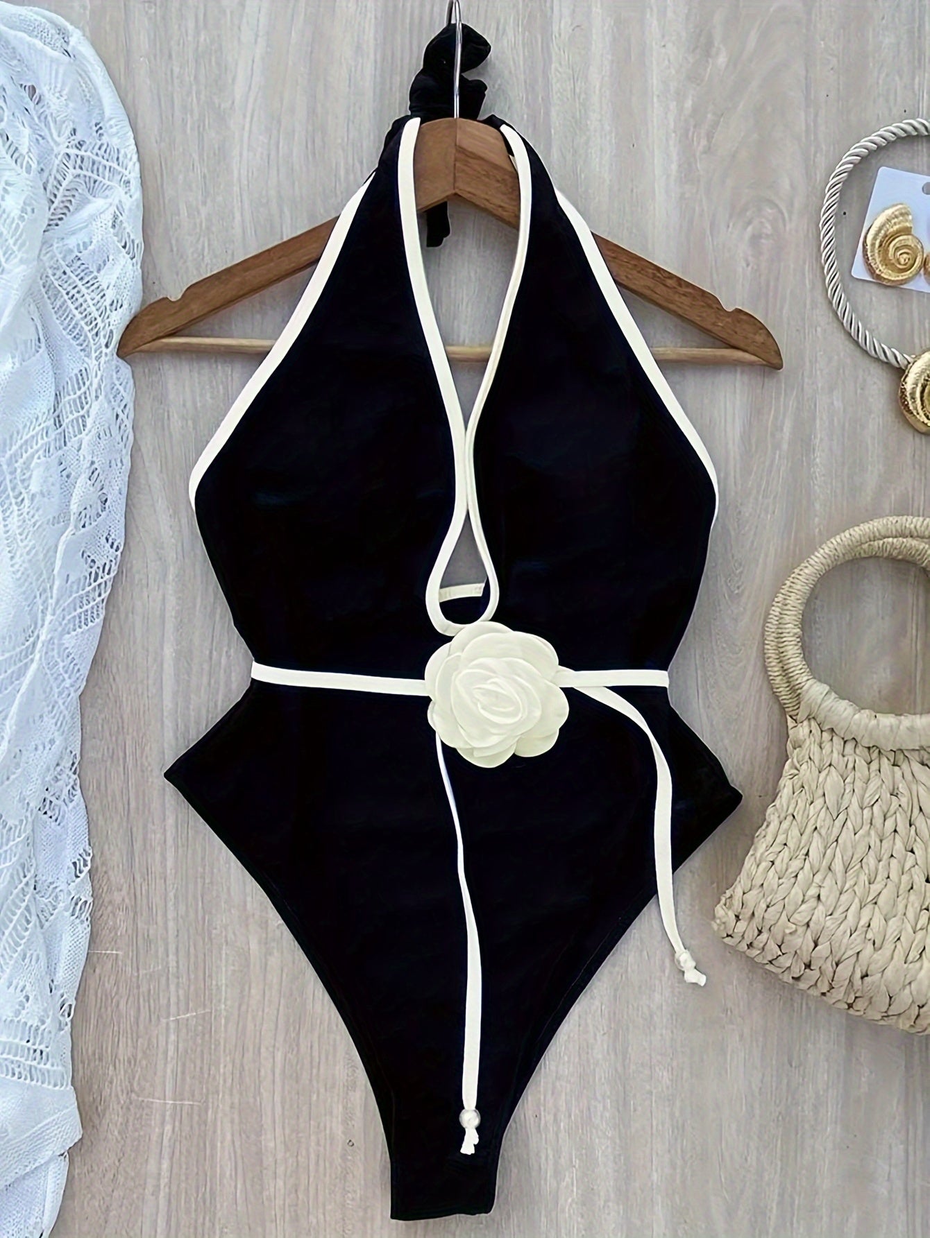 One-piece white floral tie-up beach bikini.