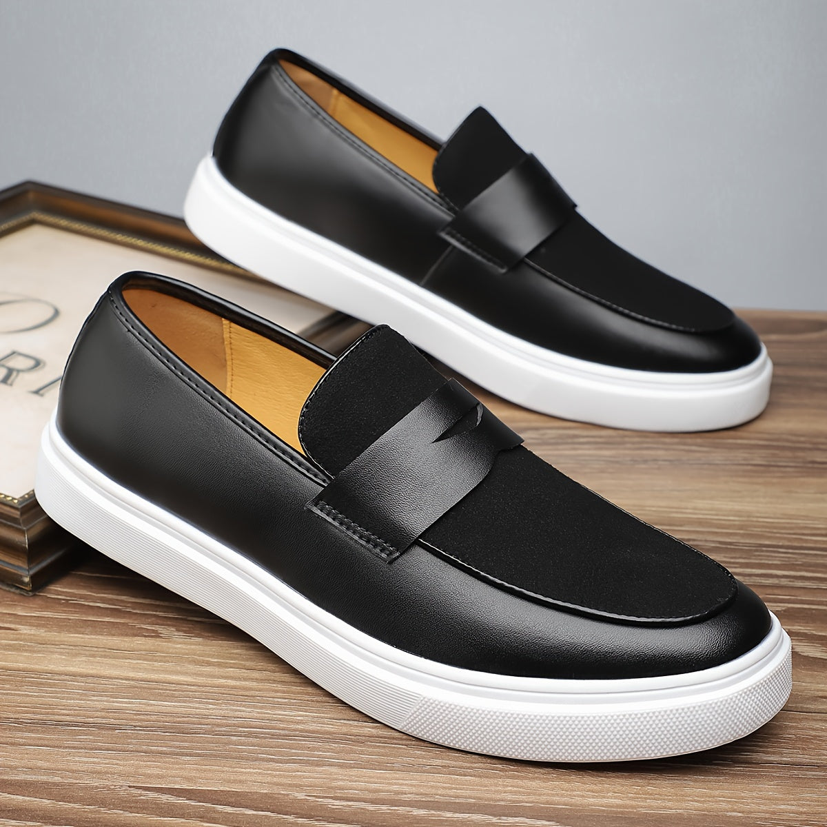 Men's preppy slip-on sneakers with low top design in solid color, featuring PU upper and inner, rubber sole, and round toe for daily wear.