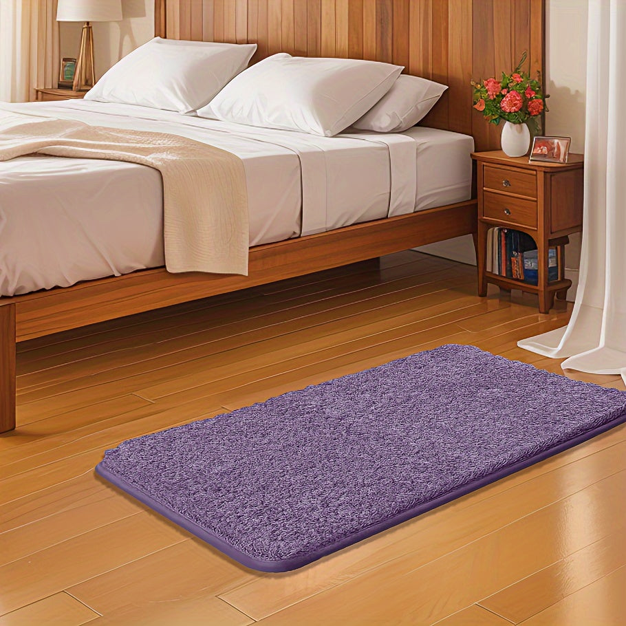 Soft and sumptuous purple bath mat offering luxury feel - highly absorbent, non-slip and fade-resistant, ideal for bathroom, bedroom and laundry room décor. Made from durable polyester, easy to clean.