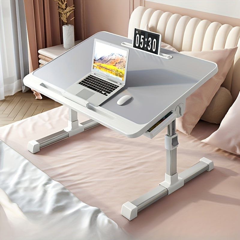 Adjustable folding bed tray with drawers, ideal for laptop use or eating in bed. Can also be used as a portable table for reading or writing. Available in silvery grey.