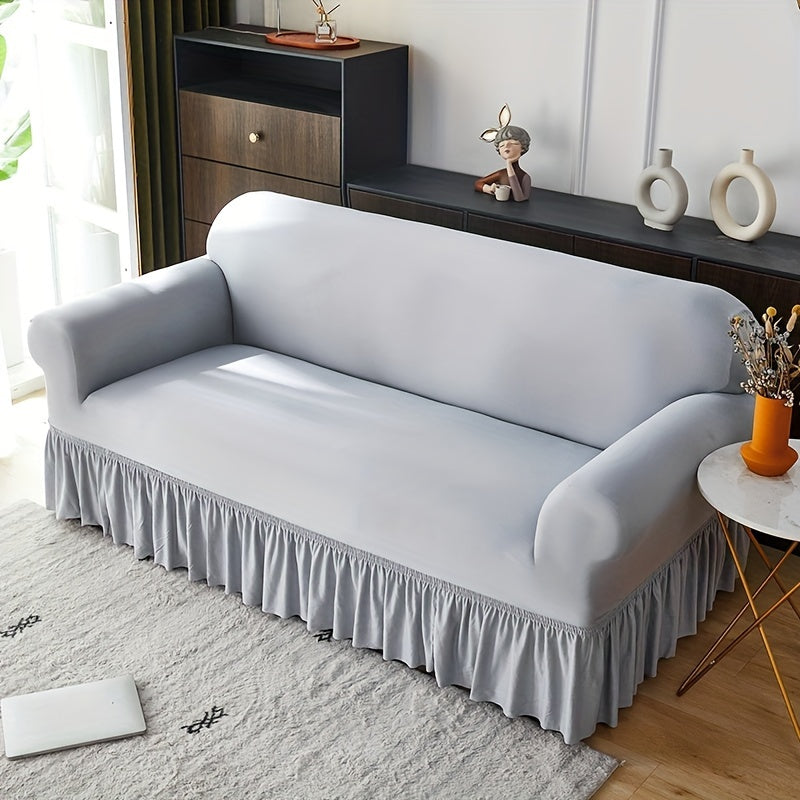 Elastic sofa cover with skirt, universal for all seasons, suitable for living room, office, and home decor.