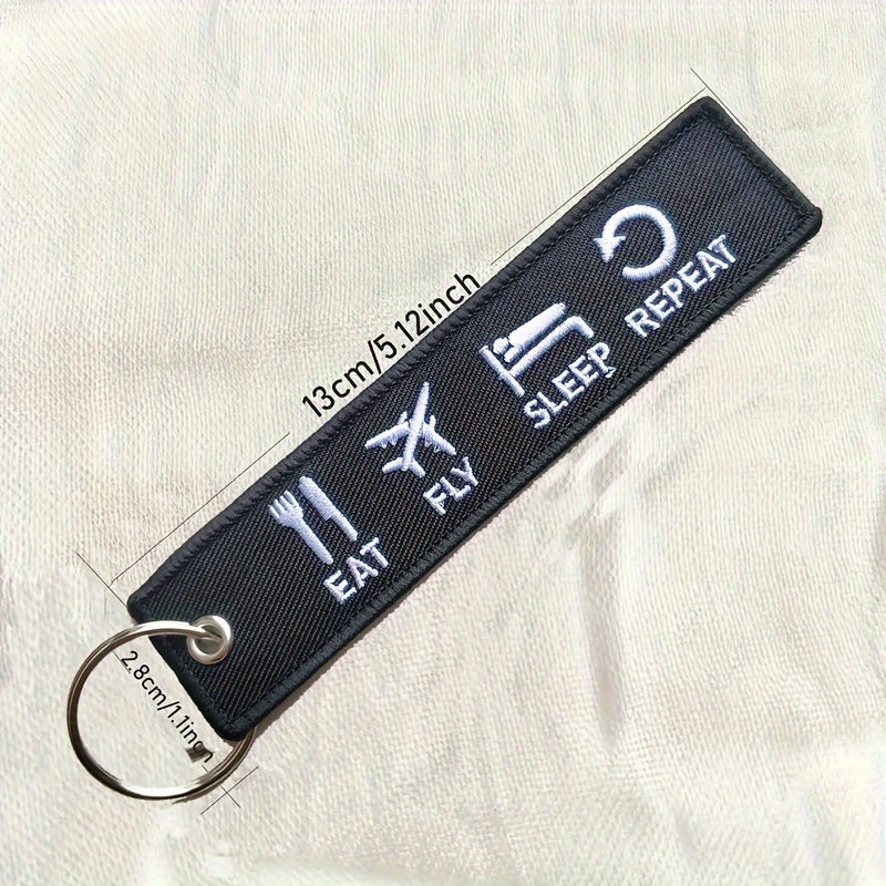 Set of three 'Eat Fly Sleep Repeat' keychains with embroidered design. Ideal gift for pilots, aviation enthusiasts, or anyone with a sense of humor. Keychains come in black and white color combination.