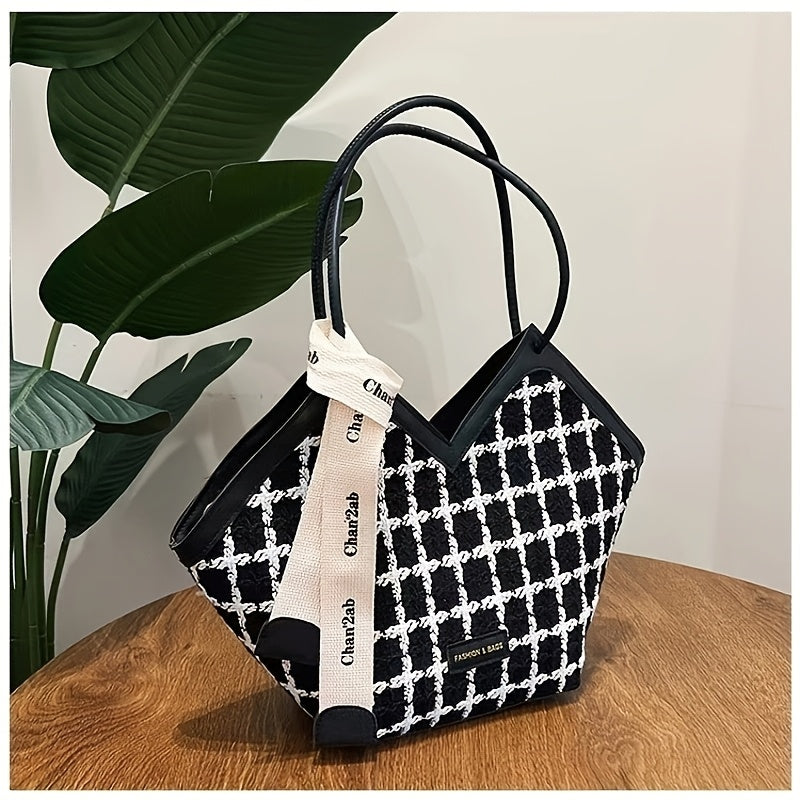 Stylish black plaid tote bag for women, spacious with zip closure and matching strap.