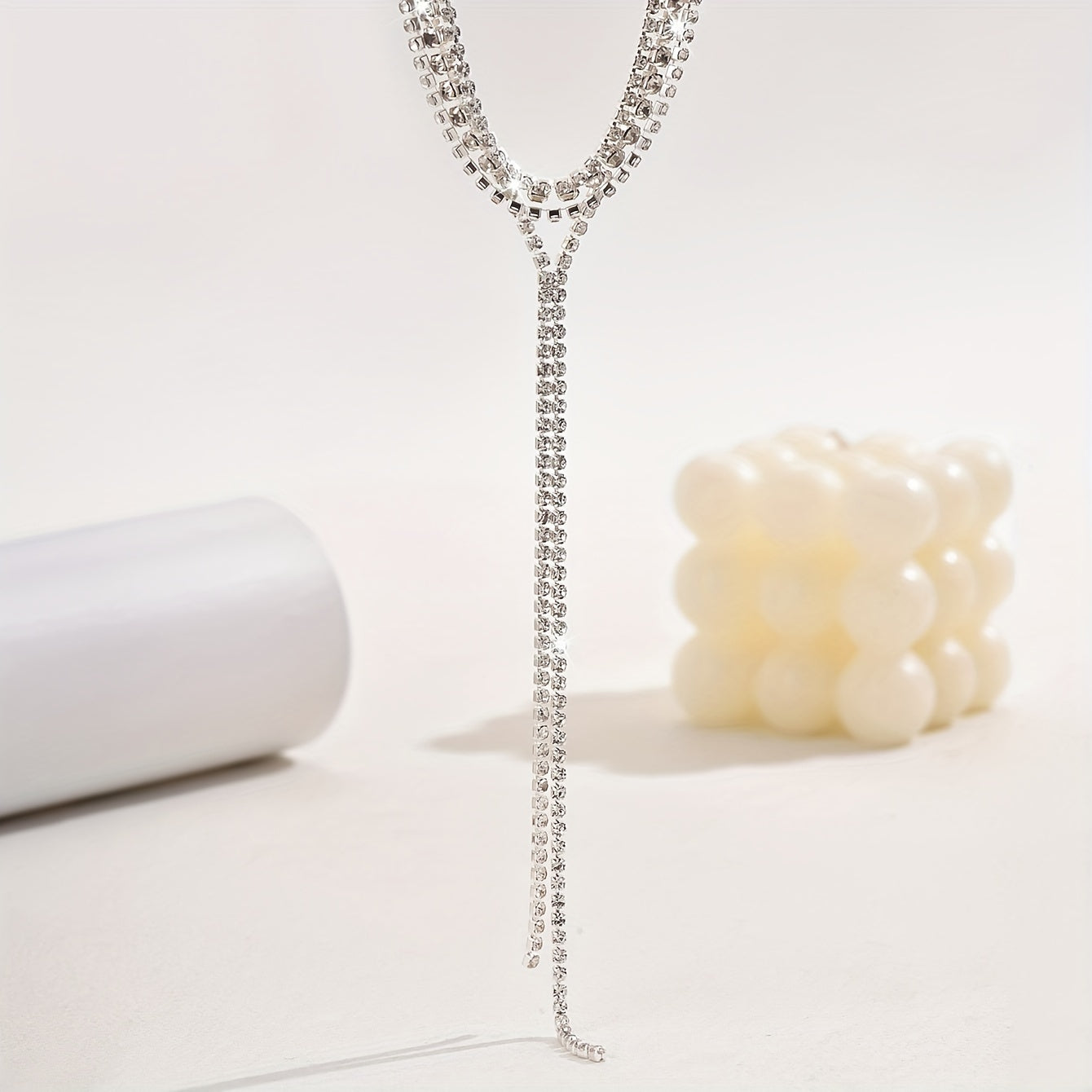 Elegant and luxurious, this black and white tassel necklace features shiny rhinestones, making it the perfect accessory for bridal events and weddings. Delicate and stylish, this multi-layer necklace is an ideal gift for any occasion.