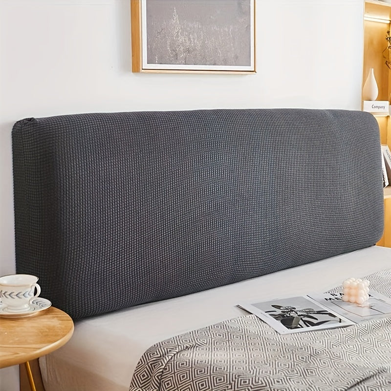 Stretchable dark green headboard cover made of cozy knit fabric that is dustproof and protective. Fits padded headboards measuring 208.28cm-238.76cm. Machine washable with an elegant