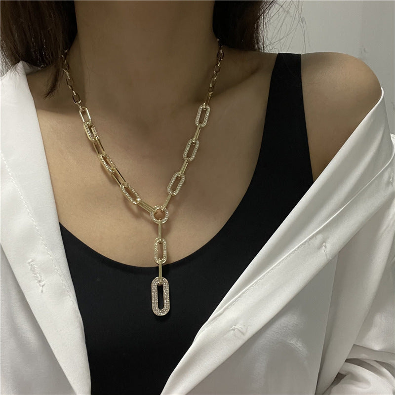 Stylish and minimalist Y-shaped chain necklace for women featuring a sparkling cubic zirconia geometric pendant.