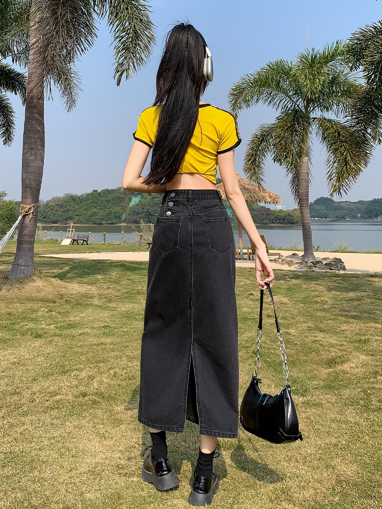 Casual denim midi skirt for women with side slit, mid-rise waist, straight cut, solid color, and pockets. Made of 55% cotton and 45% polyester blend.