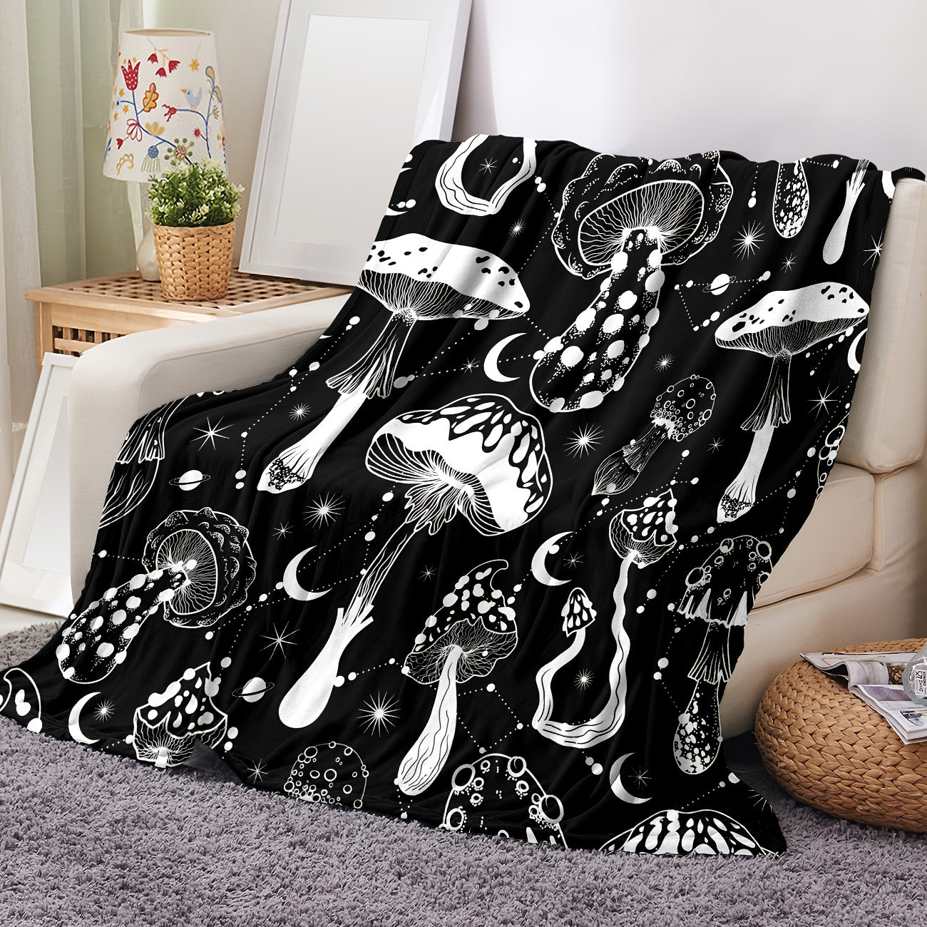 Stay cozy with this stylish Black and White Mushroom Patterned Flannel Blanket, perfect for naps, snuggling, or keeping warm. This versatile and lightweight blanket is a great gift for the home, providing comfort in the living room, bedroom, office, or