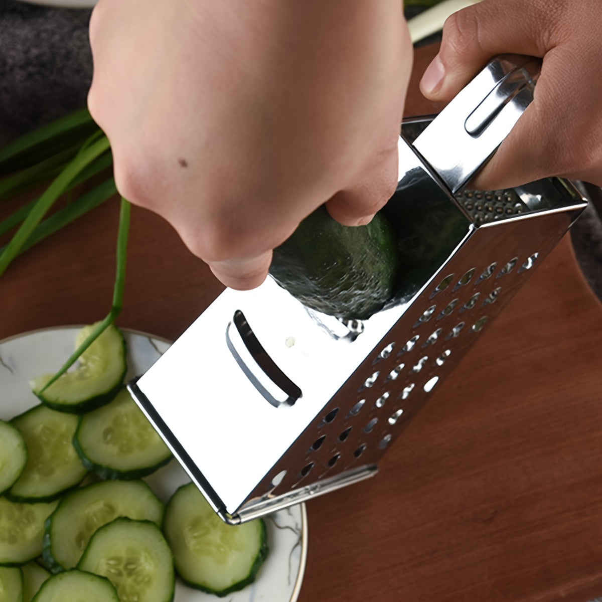 Upgrade your kitchen with the Stainless Steel 4-Sided Box Grater - a versatile tool for grating cheese, vegetables, and potatoes. This multifunctional grater features a non-slip handle for easy use.