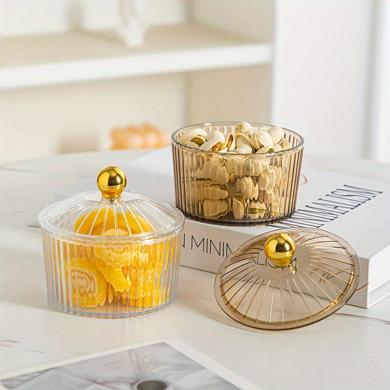 Luxurious snack serving set with lid-covered plastic dishes on a golden tray, perfect for displaying dried fruits and candies on a living room coffee table.