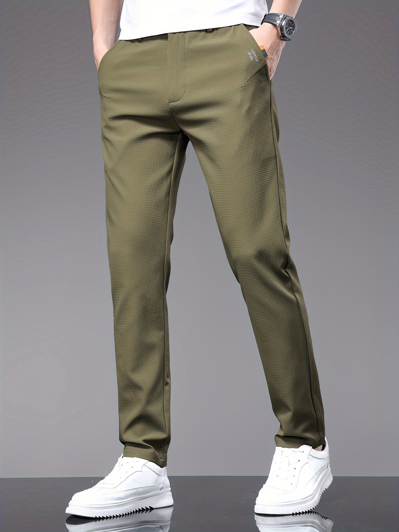 Men's slim fit pants with pockets, perfect for outdoor activities in spring and autumn.