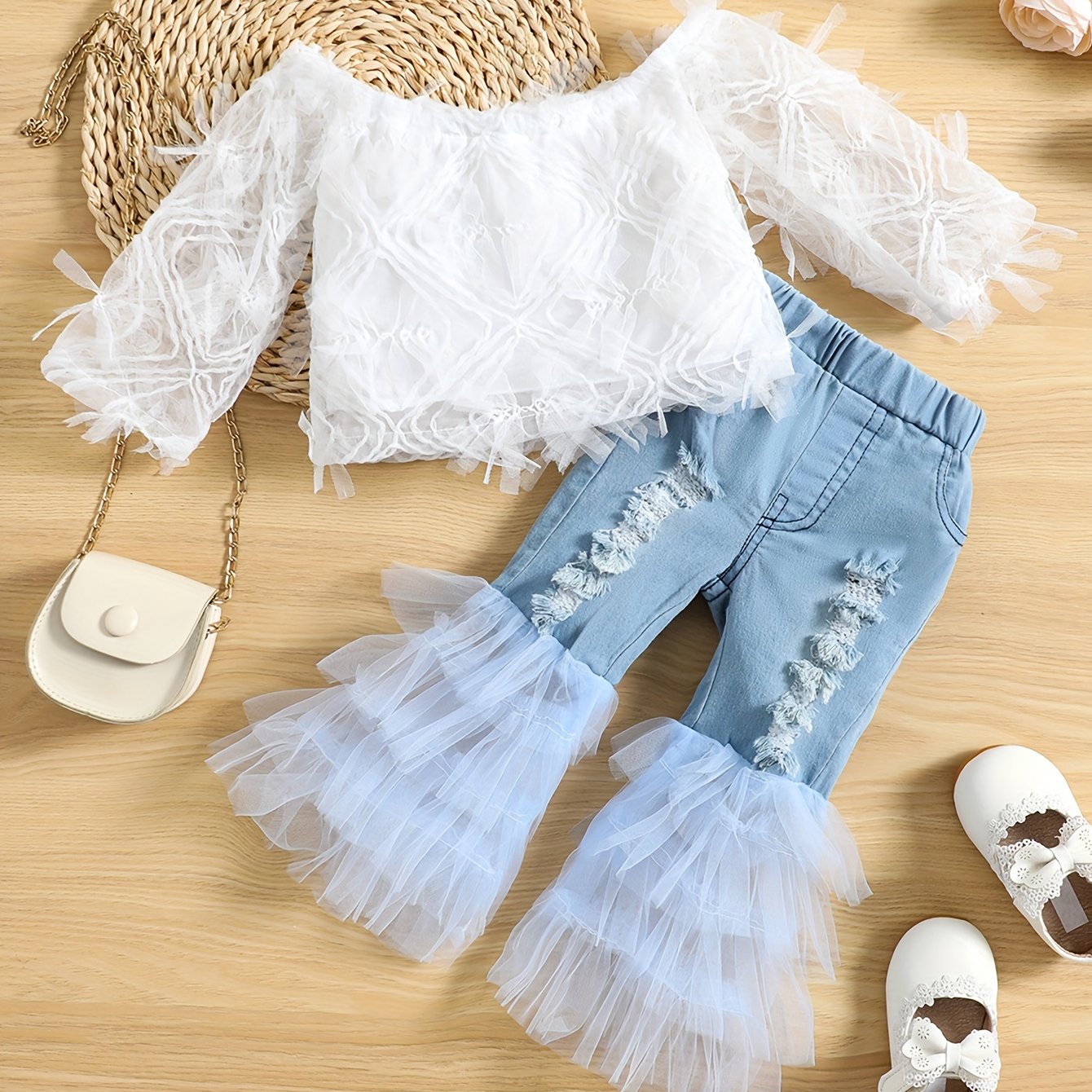 Stylish girls' summer outfit: off-shoulder white lace top with blue tulle flared pants set. Made of 100% polyester, machine washable. Perfect for outdoor wear.