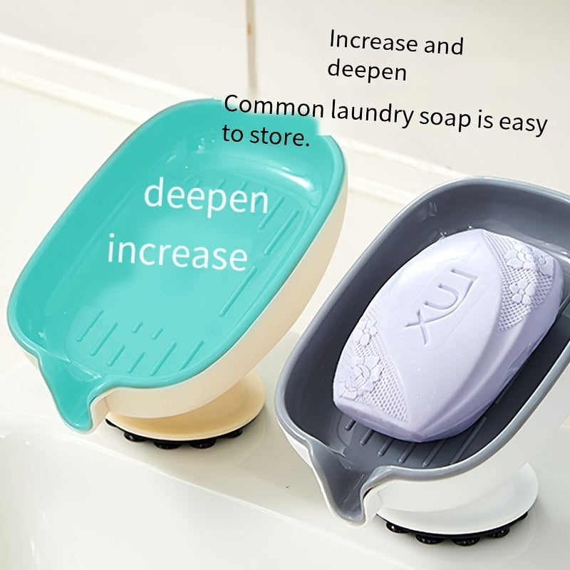 Durable plastic oval soap dish with an elegant, self-draining design for bathroom use.