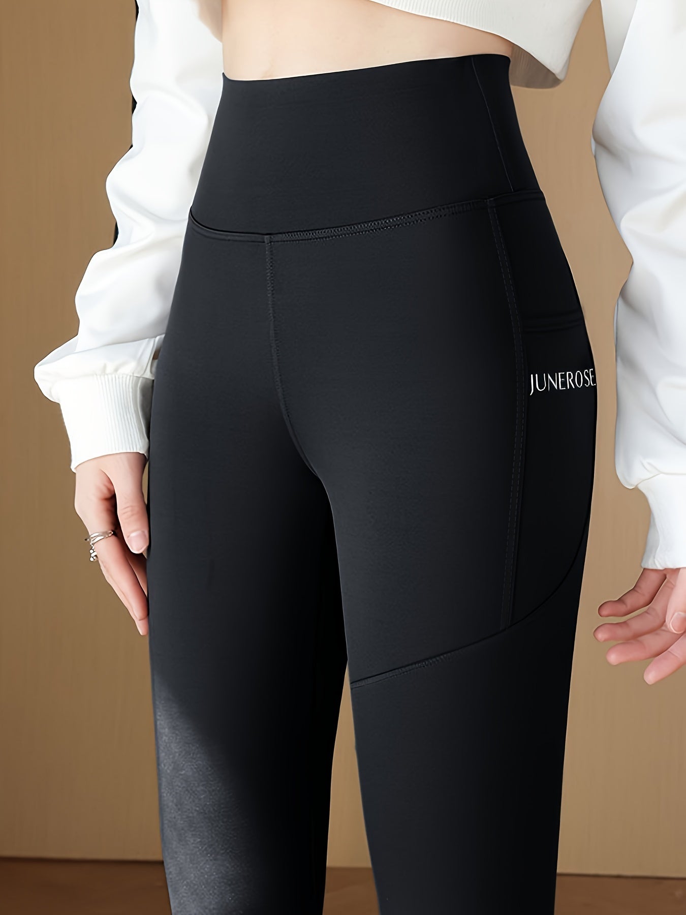 High waist compression pants with tummy control and pockets for women.