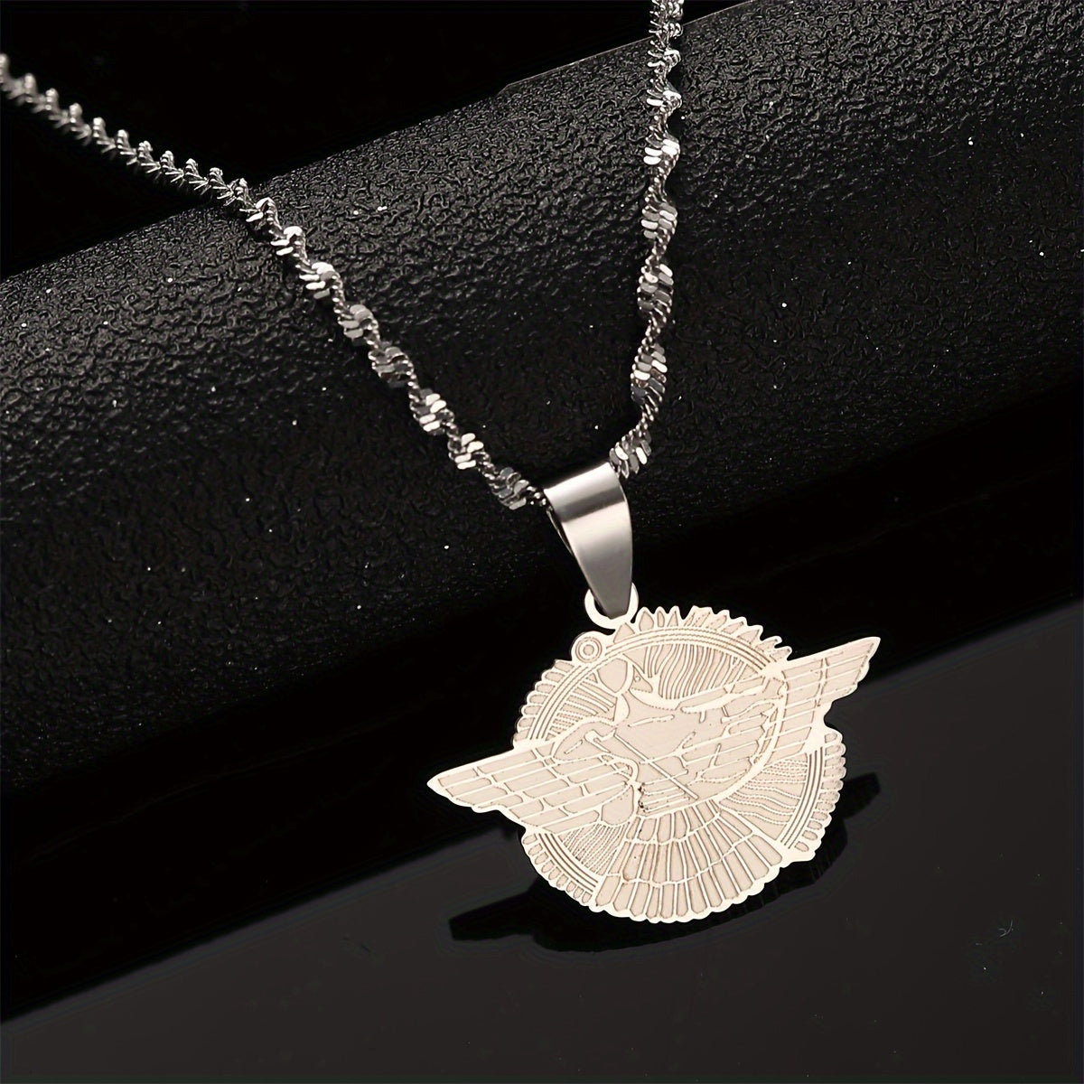 Get your hands on the stunning Ashur Pendant Necklace. Featuring a beautiful Assyrian Symbol Design in either a golden or silvery finish, this necklace is perfect for both everyday wear and special occasions. Made from durable stainless steel, this