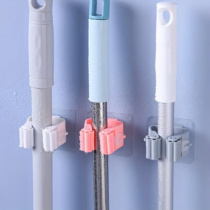 Wall-mounted holder for mops and brooms, with detachable waterproof and non-slip hook. Ideal for home, bathroom, kitchen, garden and garage organization.