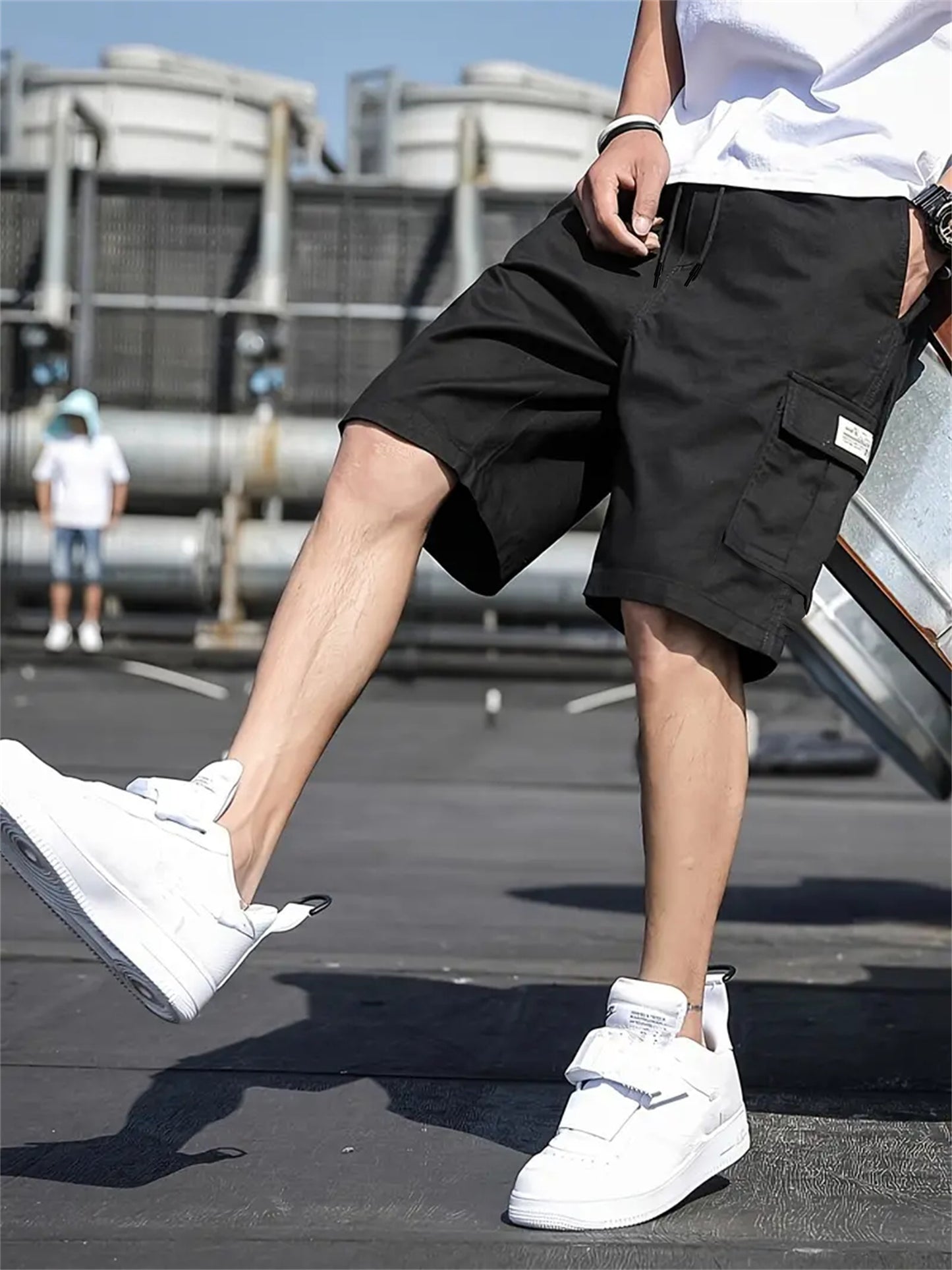 Men's plus-size cargo shorts made of lightweight polyester with pockets, drawstring waist, and suitable for basketball and streetwear.