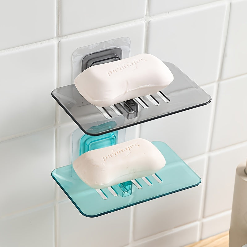 Wall-mounted soap dish with drainage, adhesive holder for bathroom organization.