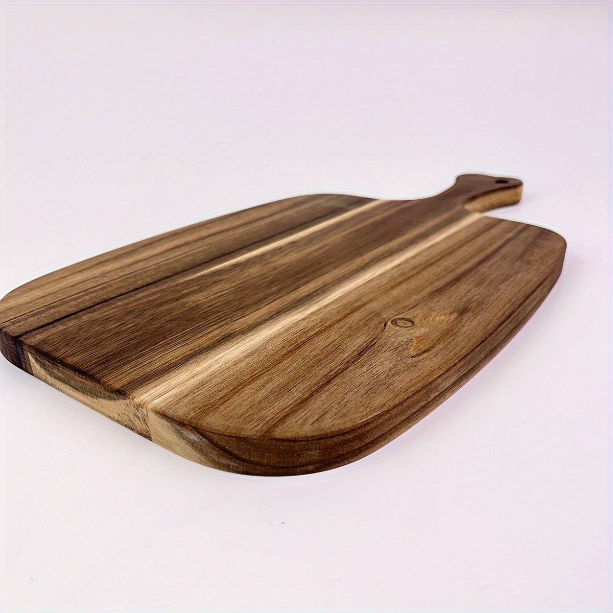 Multi-functional wood cutting board, perfect for chopping cheese, meat, bread, vegetables, and fruits. Features an extra thick design with a handle for easy transport. Durable and easy to clean, ideal for use in homes or dormitories.