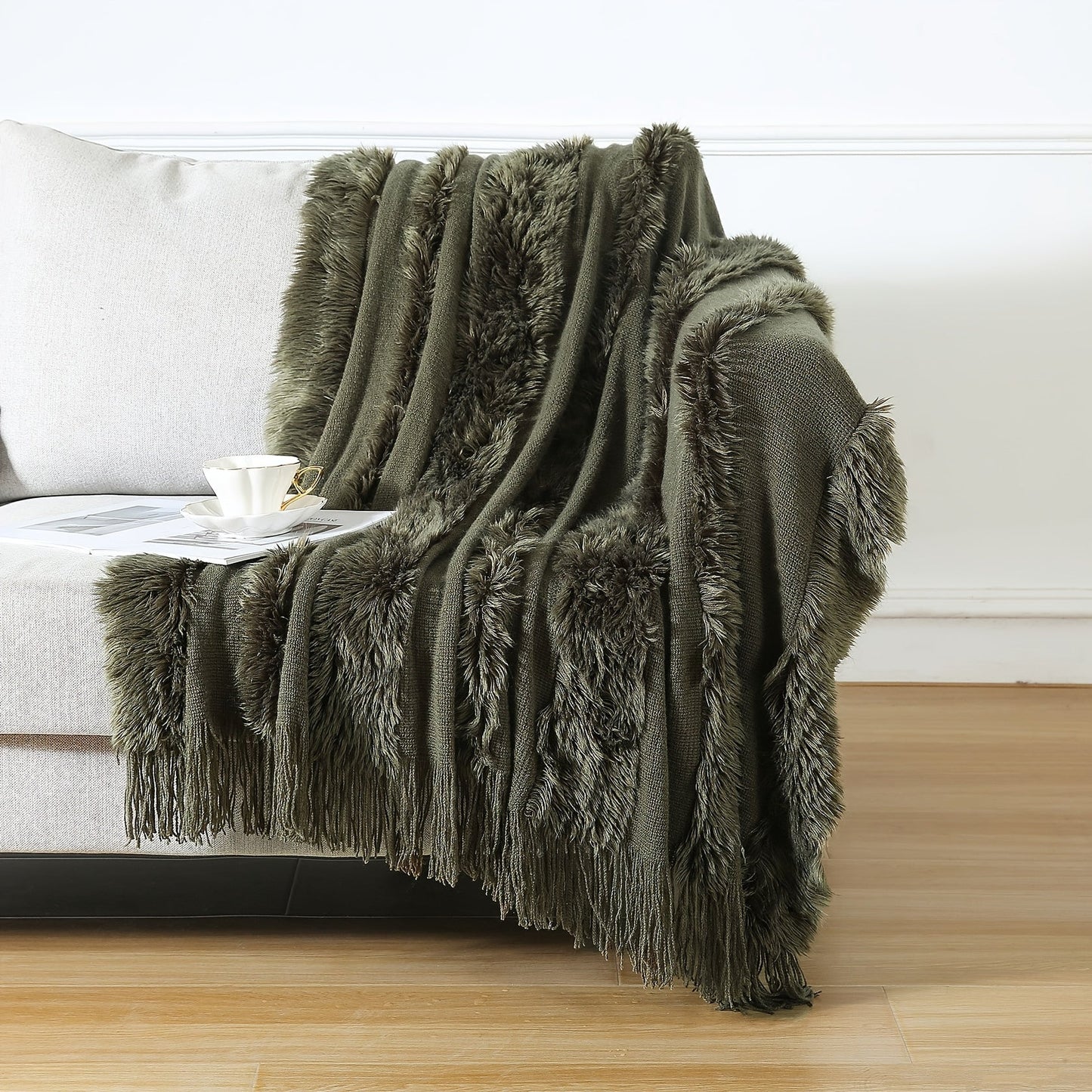 Stay cozy with this contemporary acrylic chunky knit throw blanket featuring tassels. With its solid pattern, lightweight plush texture, and machine washable design, this all-season throw is perfect for adding a touch of style and comfort to your couch