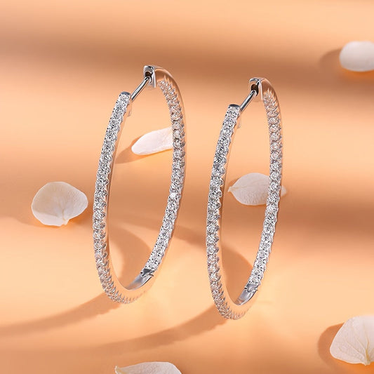 Elevate your look with the BINALOVE Luxury Moissanite Huggie Hoop Earrings. These stunning earrings are made with 925 sterling silver and are perfect for weddings, parties, or any special occasion. Featuring the December birthstone, these earrings are