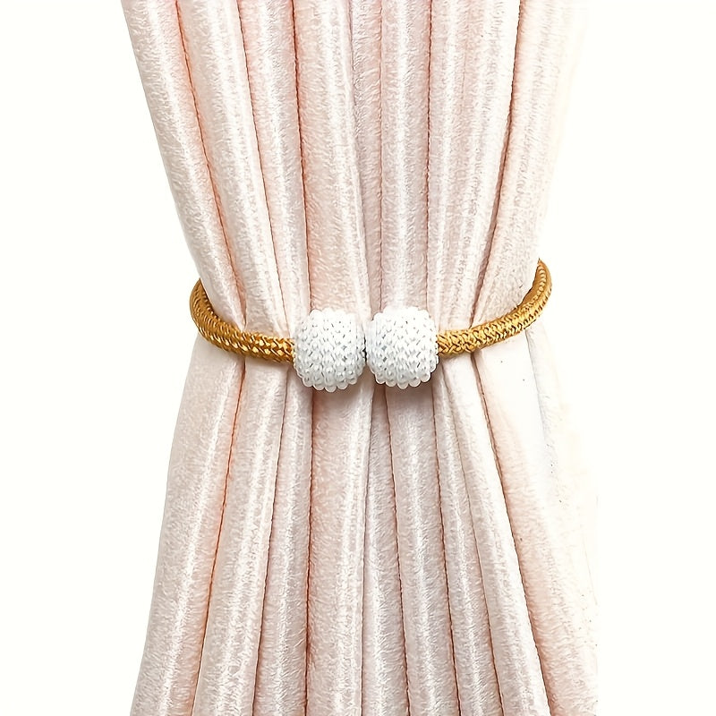 Upgrade your home decor with our Gift 2 Classic Style Magnetic Curtain Ties. Featuring a European design and a strong magnetic braided rope, these ties are perfect for adding a touch of elegance to any room in your home.