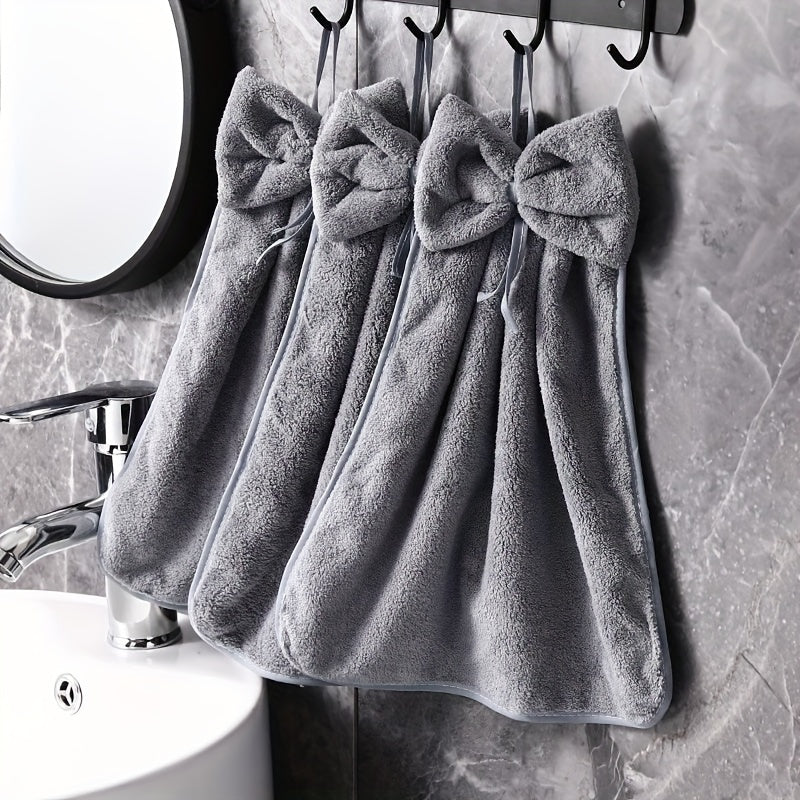 3-piece kitchen towel set with bowknot skirt pattern. Absorbent and quick-drying for household cleaning. Ideal kitchen essentials.