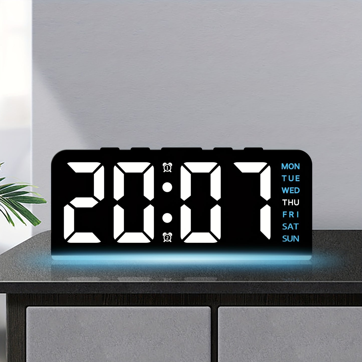 Digital LED Alarm Clock with USB power, sleek black plastic frame, dual time display, modern design for bedroom decor. Battery-operated (AAA not included).