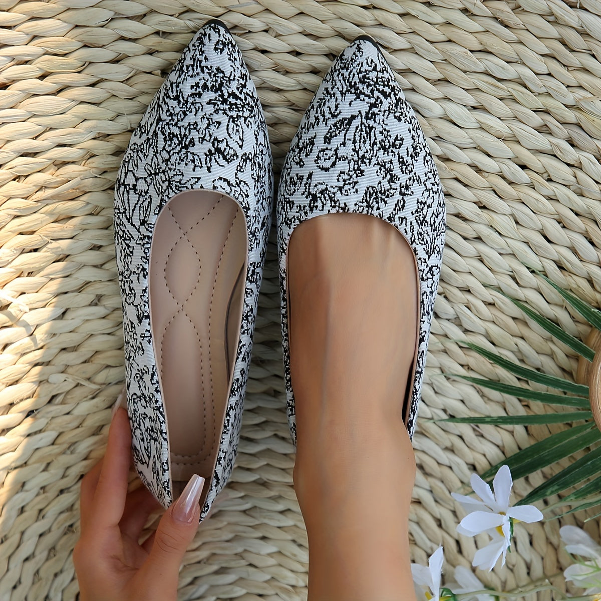 Floral flat shoes with pointed toe and soft sole for daily wear.