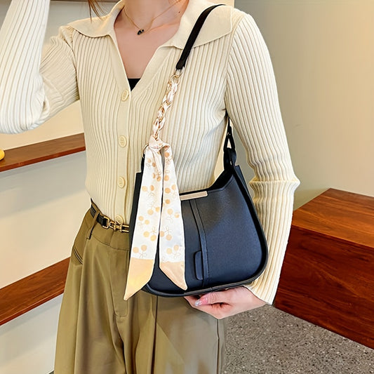 Chic underarm shoulder bag for women made of soft faux leather with a contrast color design.