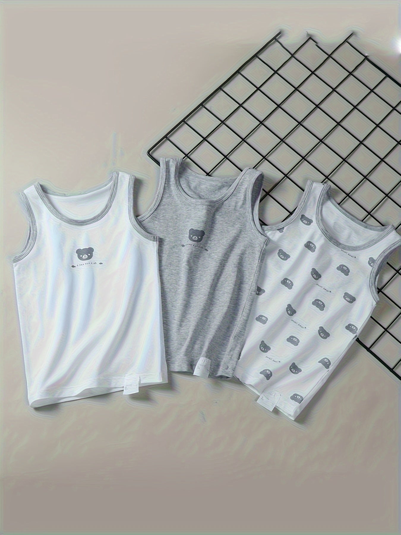 Set of 3 kids' strapless cotton vests with animal print, made from casual knit fabric with slight stretch in a regular fit for children.