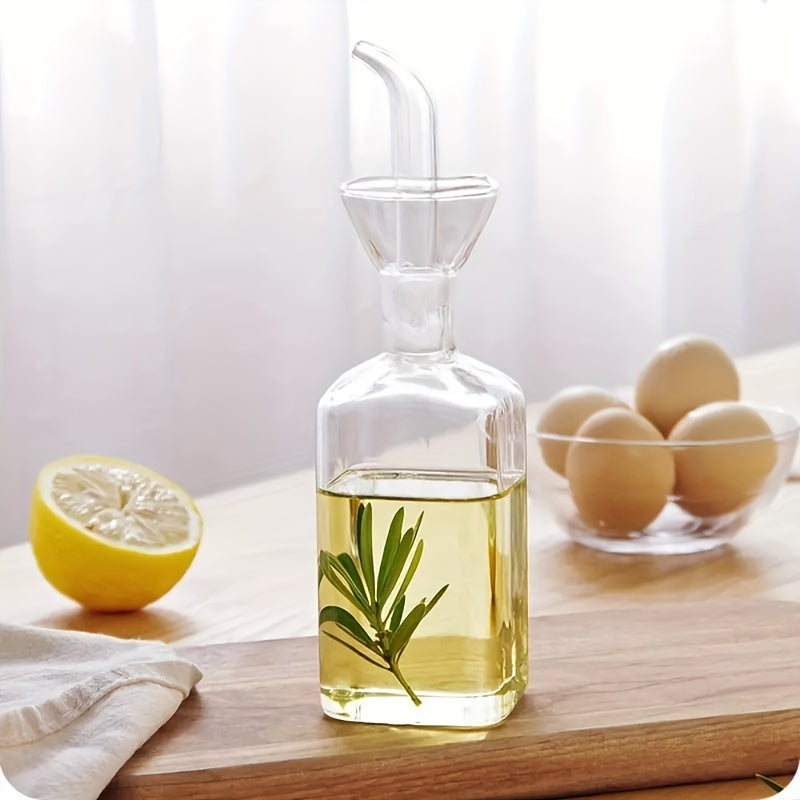 Transparent oil dispenser available in 5oz, 6.7oz, and 15.2oz sizes. This leakproof glass bottle is perfect for storing olive oil, vinegar, and other liquid seasonings. Suitable for cooking, baking, salad, and grilling. A must-have in your kitchen