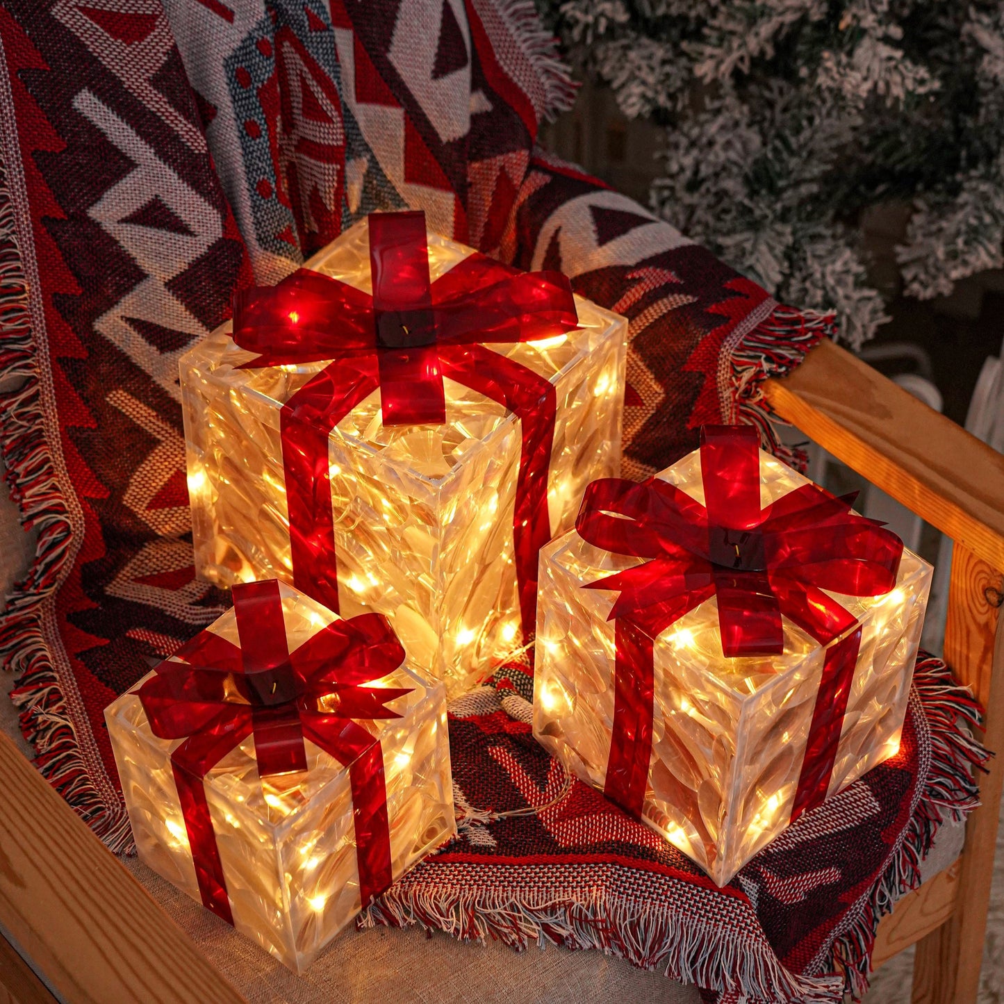 3 Christmas lighted gift boxes with warm white lights and red bows for decorating Christmas trees, yards, homes, and outdoor spaces.