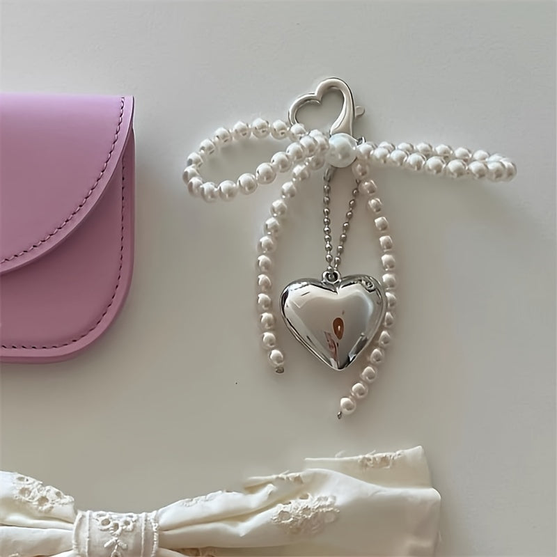 Large heart-shaped metal pendant with pearl bow - ideal for Valentine's Day. Versatile accessory for mobile phone cases, cameras, bags, and keychains. Perfect gift for women and girls.