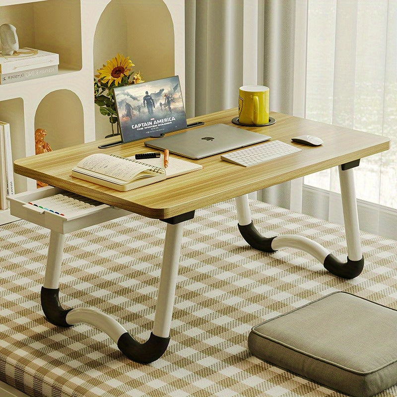 Foldable laptop desk with sturdy material and spacious desktop, suitable for student dorms.