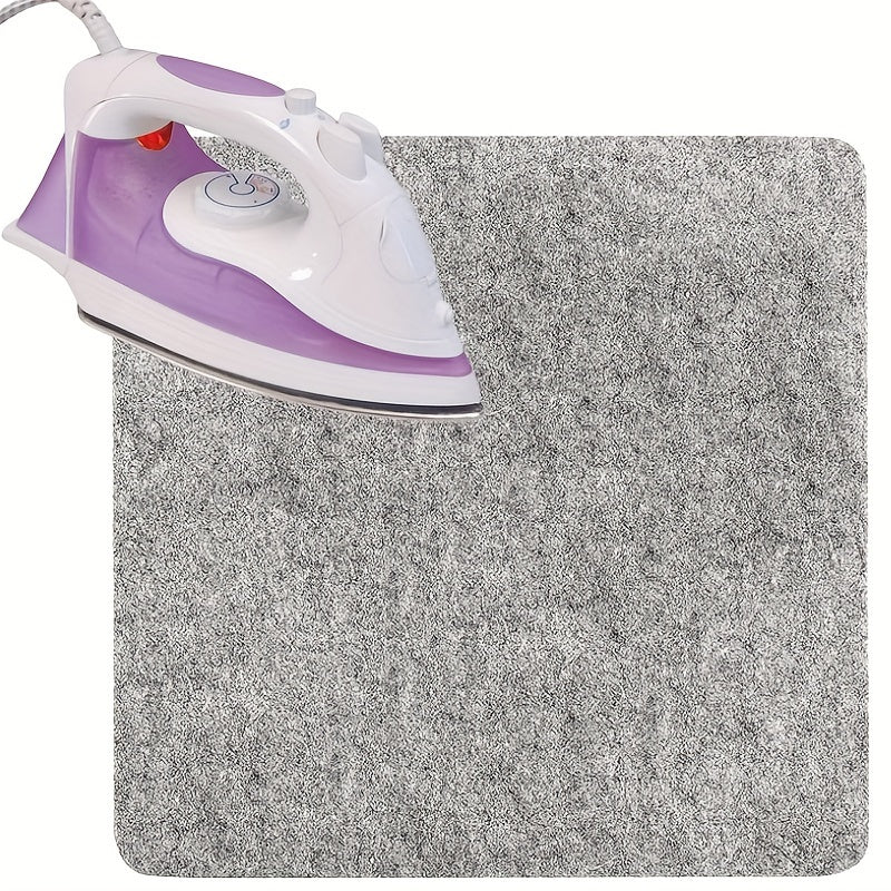 This portable wool pressing mat is perfect for quilting and sewing. It measures 25.4x0.0cm / 34.29x34.29cm and is made of felt for ironing. No power is needed, making it ideal for craft supplies.