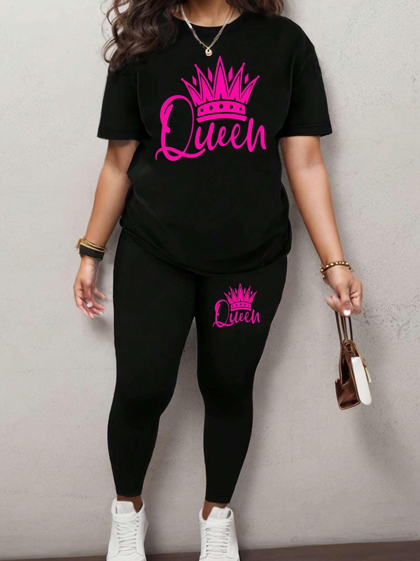 Women's activewear set with a queen crown graphic, stretchy polyester blend, machine washable, crew neck tee and long pants.