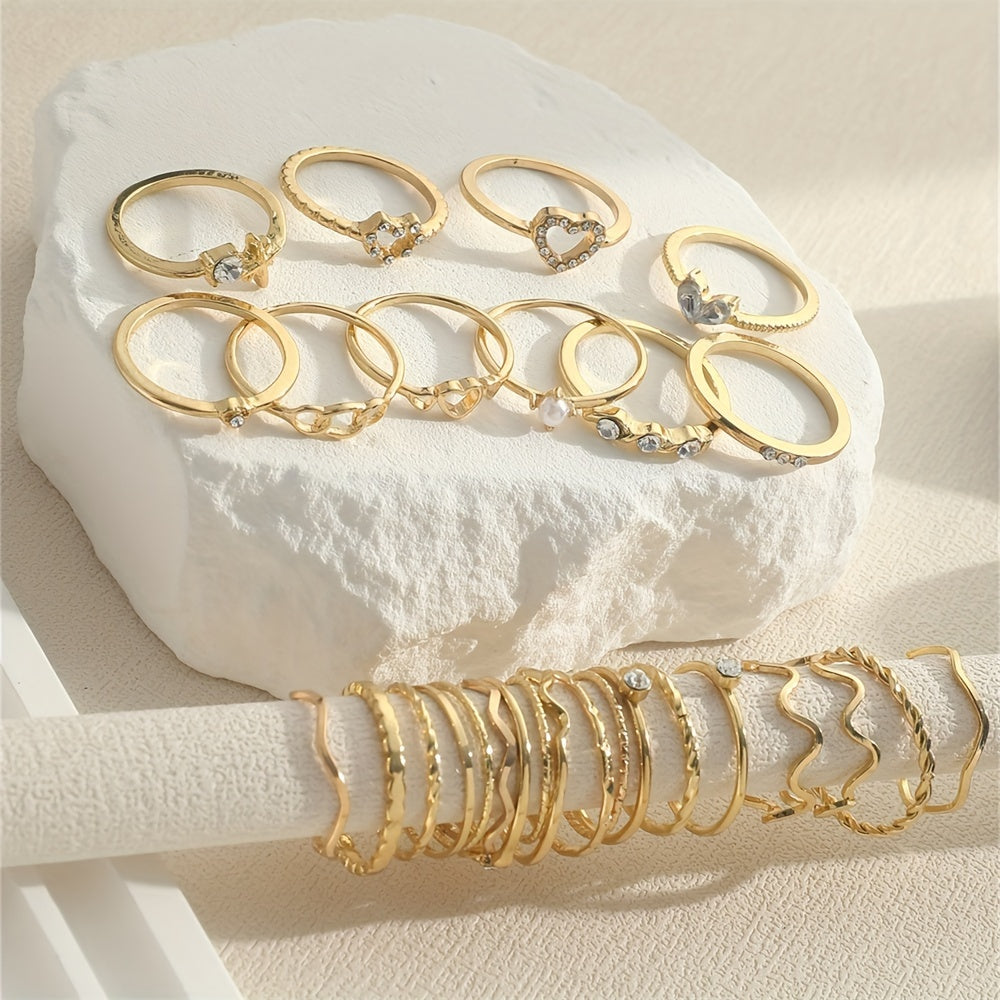 A 28-piece set of stylish alloy iron stacking rings with heart, geometric, and wavy designs for versatile wear.