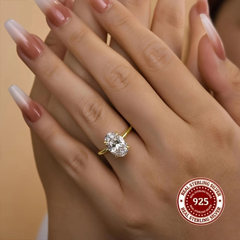 Luxurious minimalist ring made with 925 sterling silver featuring an oval cut synthetic zirconia in a claw setting. Available in 1CT, 2CT, or 3CT options for both weddings and daily wear. Weighing 2.5g, this ring is adorned with a simulated diamond for a