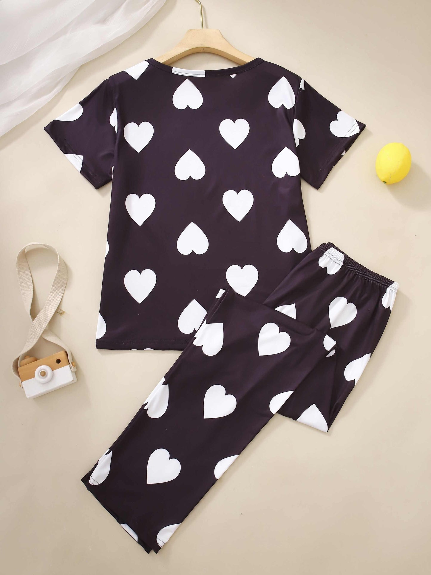 Two-piece pajama set with short-sleeved top and long pants in print.