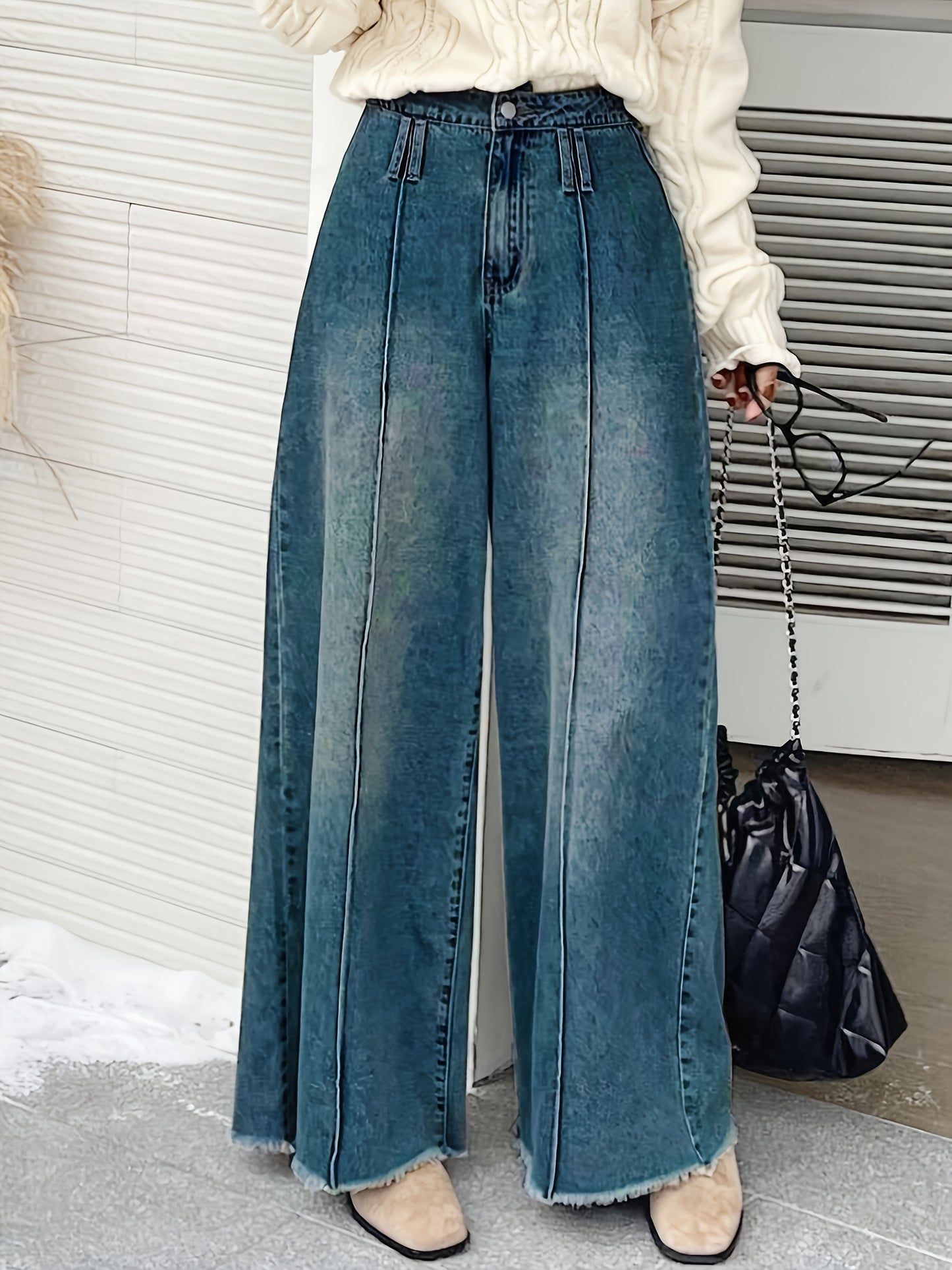 Women's wide-leg denim jeans with elastic waistband, loose fit, mid-rise, and slash pockets in light to dark blue gradient.