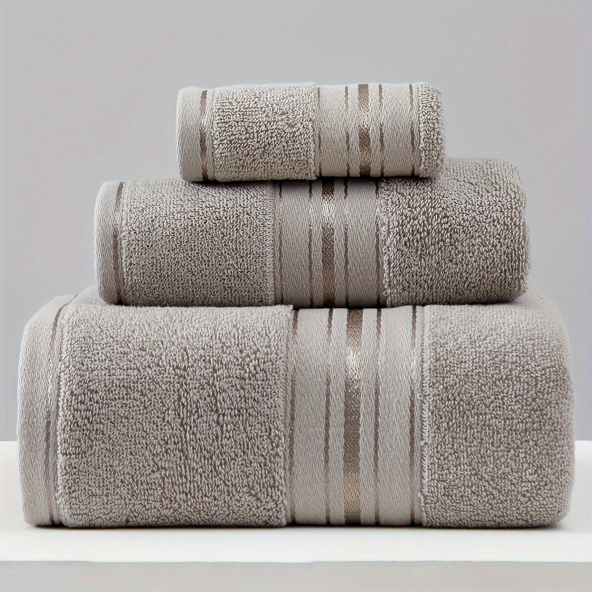 3-piece cotton towel set includes a washcloth, hand towel, and bath towel. Absorbent, quick-drying, super soft, and skin-friendly. Ideal for home bathroom use.