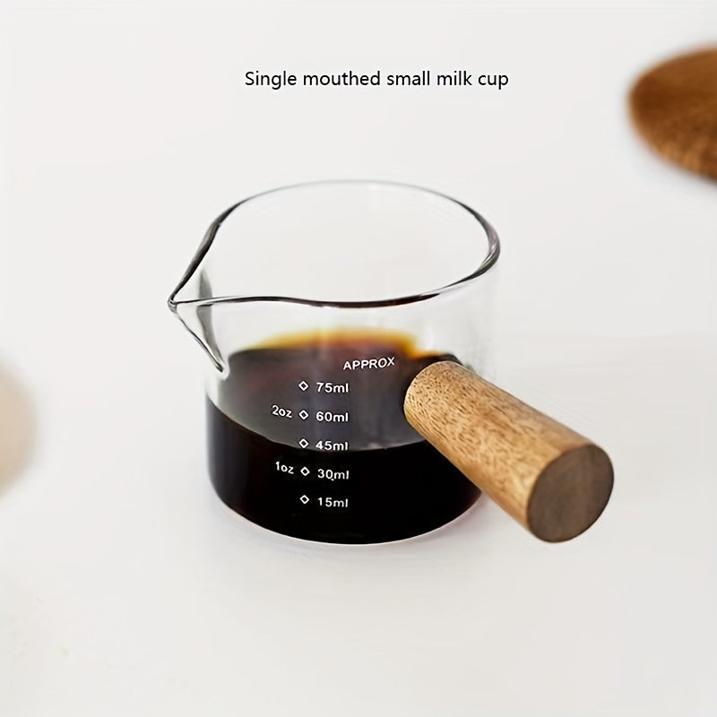 Small and stylish, this 2oz measuring cup features a heat-resistant glass body and a convenient wooden handle for easy use. With dual spout, scale markings, and ideal for measuring small quantities, this cup is perfect for both coffee and kitchen use.