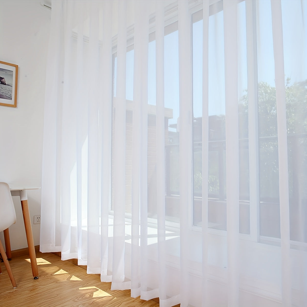 Transform your living room, bedroom, or office with this elegant sheer curtain in pure white - Lightweight and translucent with a rod pocket design, perfect for enhancing your home decor.