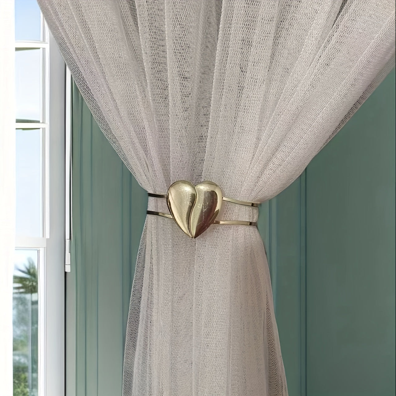 Heart-shaped decor curtain holder made of alloy, featuring a minimalist hollow design. Perfect for use in living rooms, offices, or homes as a stylish and functional curtain accessory.