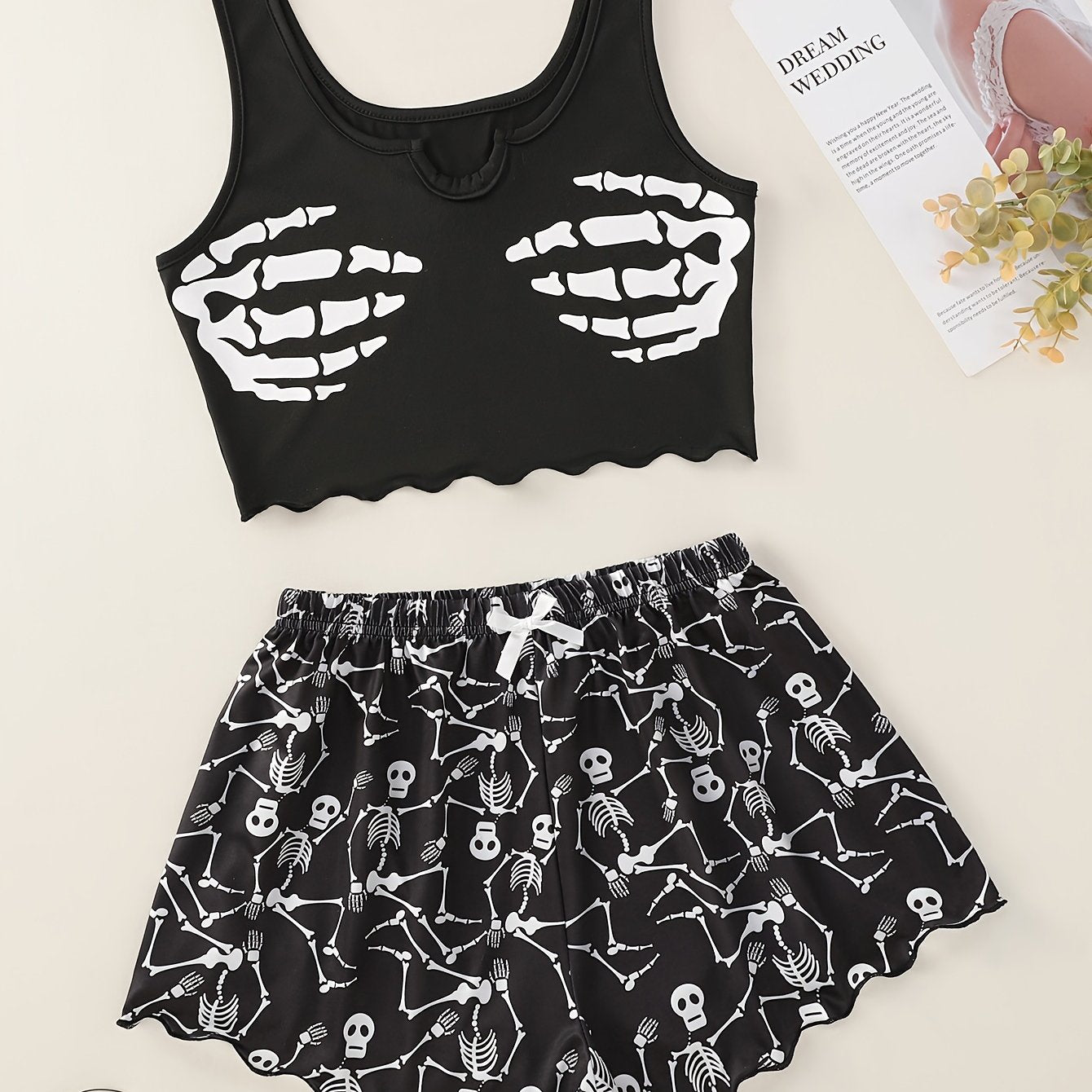 Skull print pajama set with lettuce trim tank top and shorts for women's loungewear and sleepwear at a music festival.