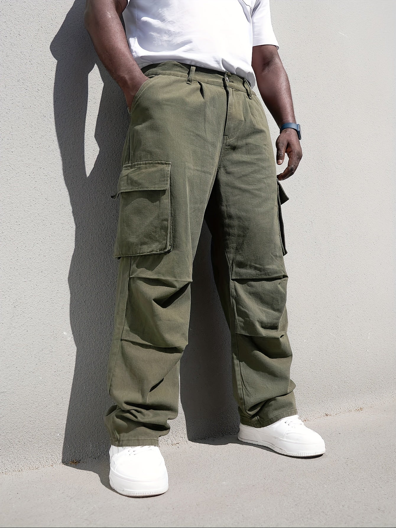 Men's plus size casual denim trousers with loose fit, cotton cargo pants featuring multiple pockets for a trendy look.