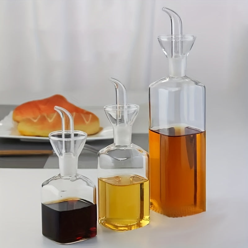 Transparent oil dispenser available in 5oz, 6.7oz, and 15.2oz sizes. This leakproof glass bottle is perfect for storing olive oil, vinegar, and other liquid seasonings. Suitable for cooking, baking, salad, and grilling. A must-have in your kitchen