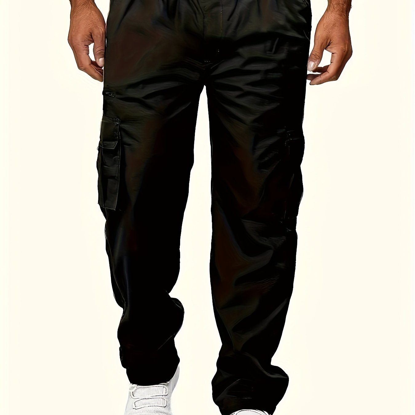 Men's black cargo pants with multiple pockets, made of durable polyester for outdoor casual wear. Features an elastic waistband and ankle straps, machine washable and suitable for all